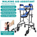 Black steel standing walker with blue padded underarm and chest supports and an eight-wheel base, with an inset close-up of a hand squeezing the red handbrake lever