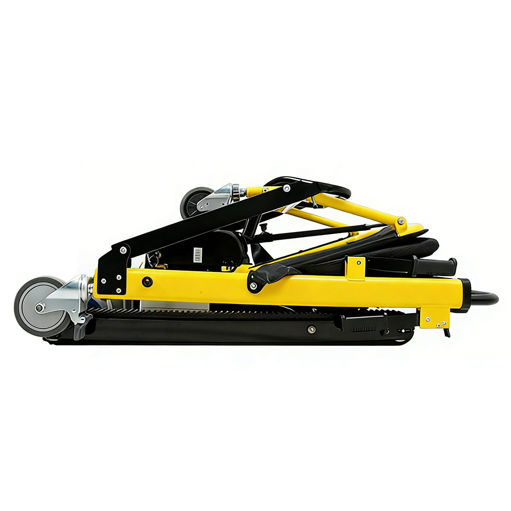 Side profile of the stair climbing wheelchair folded completely flat, showing the full length of the black rubber climbing track